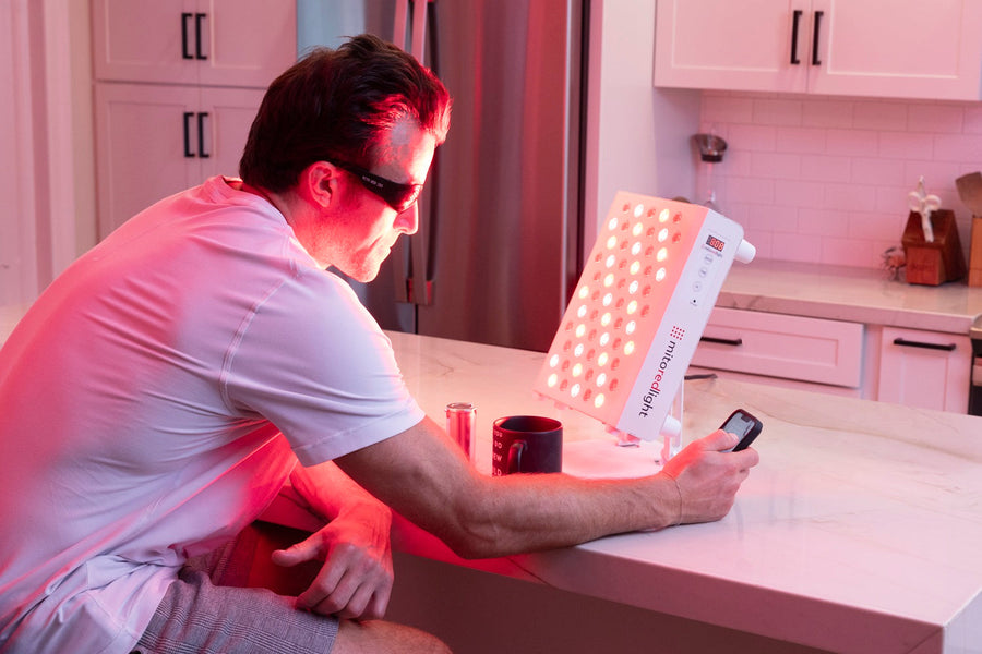 Man using MitoPRO 300+ red light therapy panel