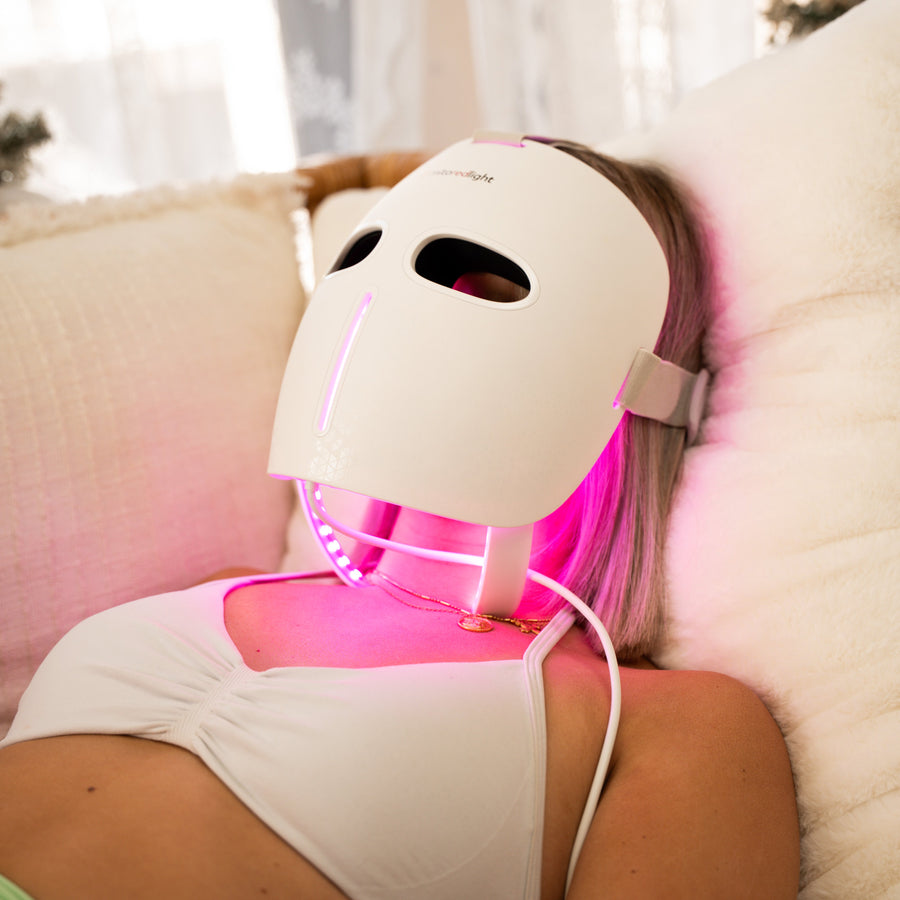 girl with mitoglow led face mask laying down