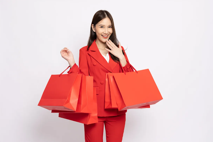 Woman holding red bags